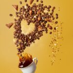 coffee beans on white ceramic mug